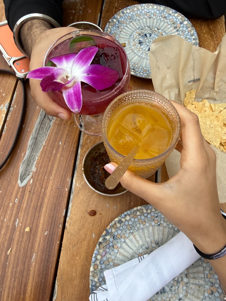 Drinks on table with flower garnish