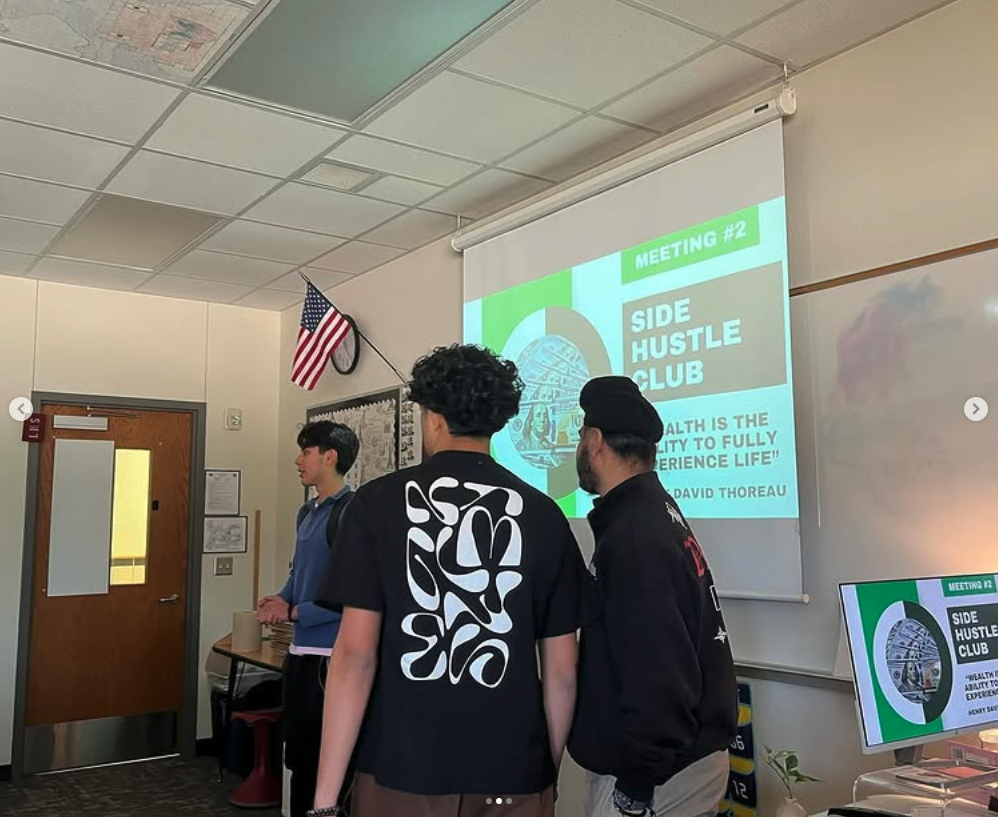 Side Hustle Club meeting with speaker and slides